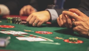 Hand of Blackjack players at the casino table