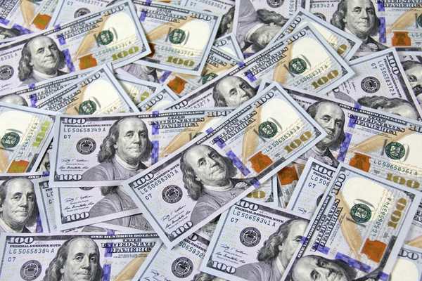 a stack of dollars piled up