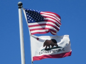 USA flag flying above California state flag