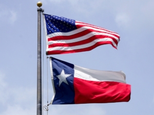 USA flag flying above Texas state flag