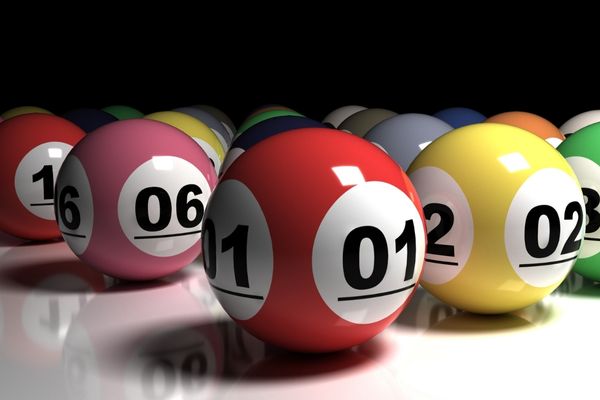 keno numbers with a dark background Colorful lottery balls on white tabletop