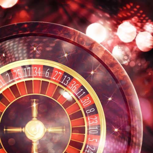 a red roulette wheel spinning the white ball a red roulette wheel spinning the white ball