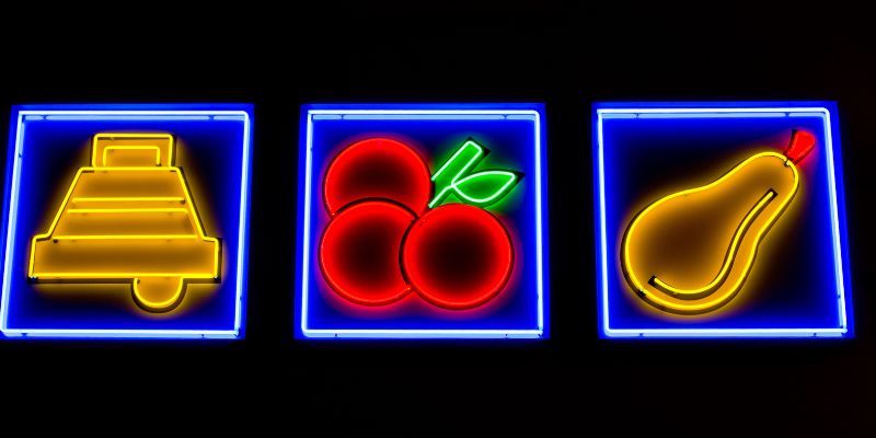 a row of progressive slot reals brightly-lit up a row of progressive slot reals brightly-lit up