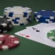 Casino chips with two Aces on casino table
