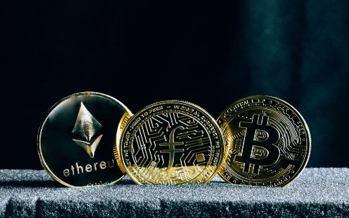 3 gold cryptocurrency coins