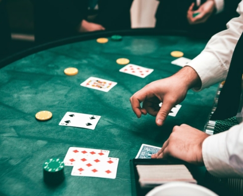 Live Blackjack dealer at casino table