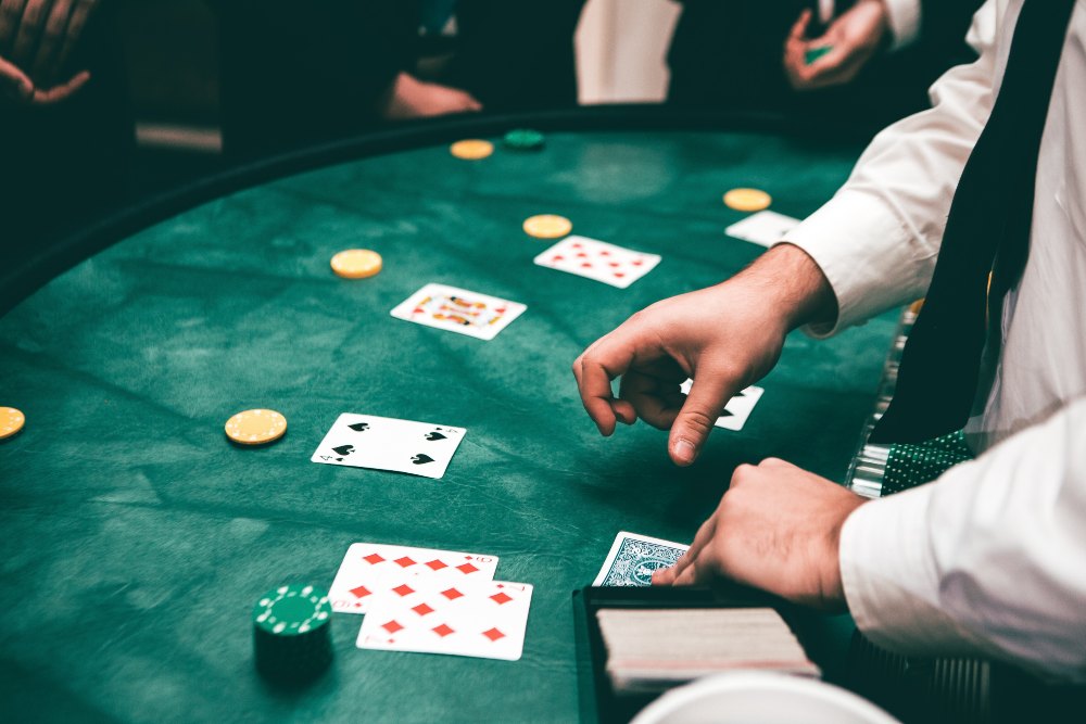 Live Blackjack dealer at casino table