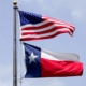 USA flag flying above Texas state flag