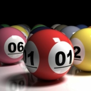 Colorful lottery balls on white tabletop