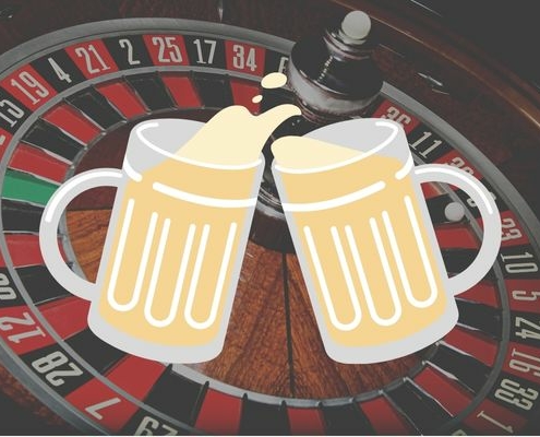 tall boy roulette with two beer glasses on a roulette table