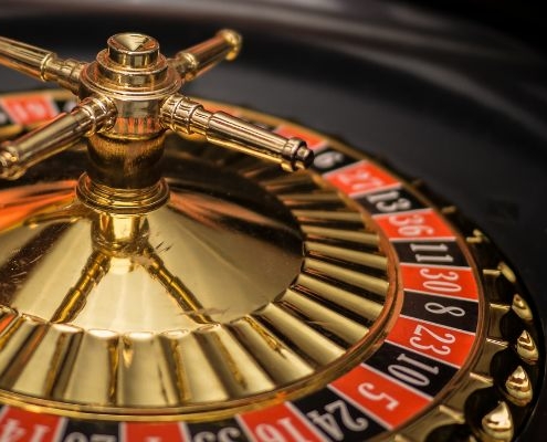 a beautiful golden roulette table with pockets