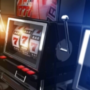 three slot machines with winning slot reels