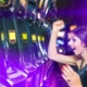 two women celebrating a win on a slot machine